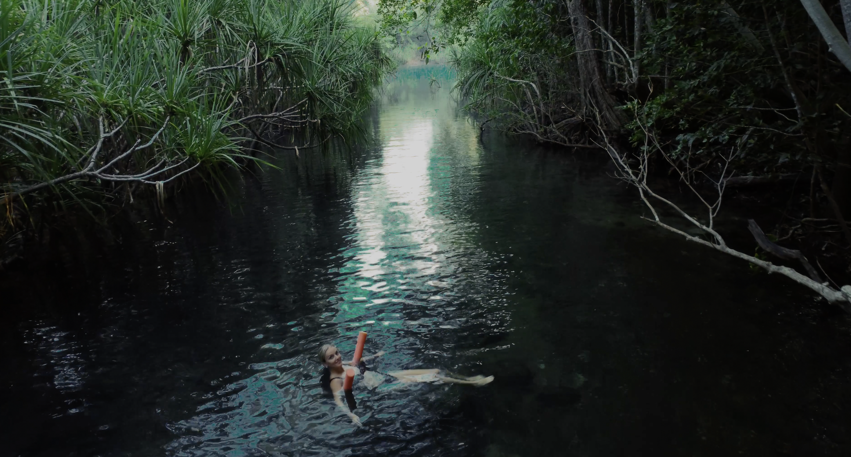 Woman swimming in Berry Springs Nature Park, NT