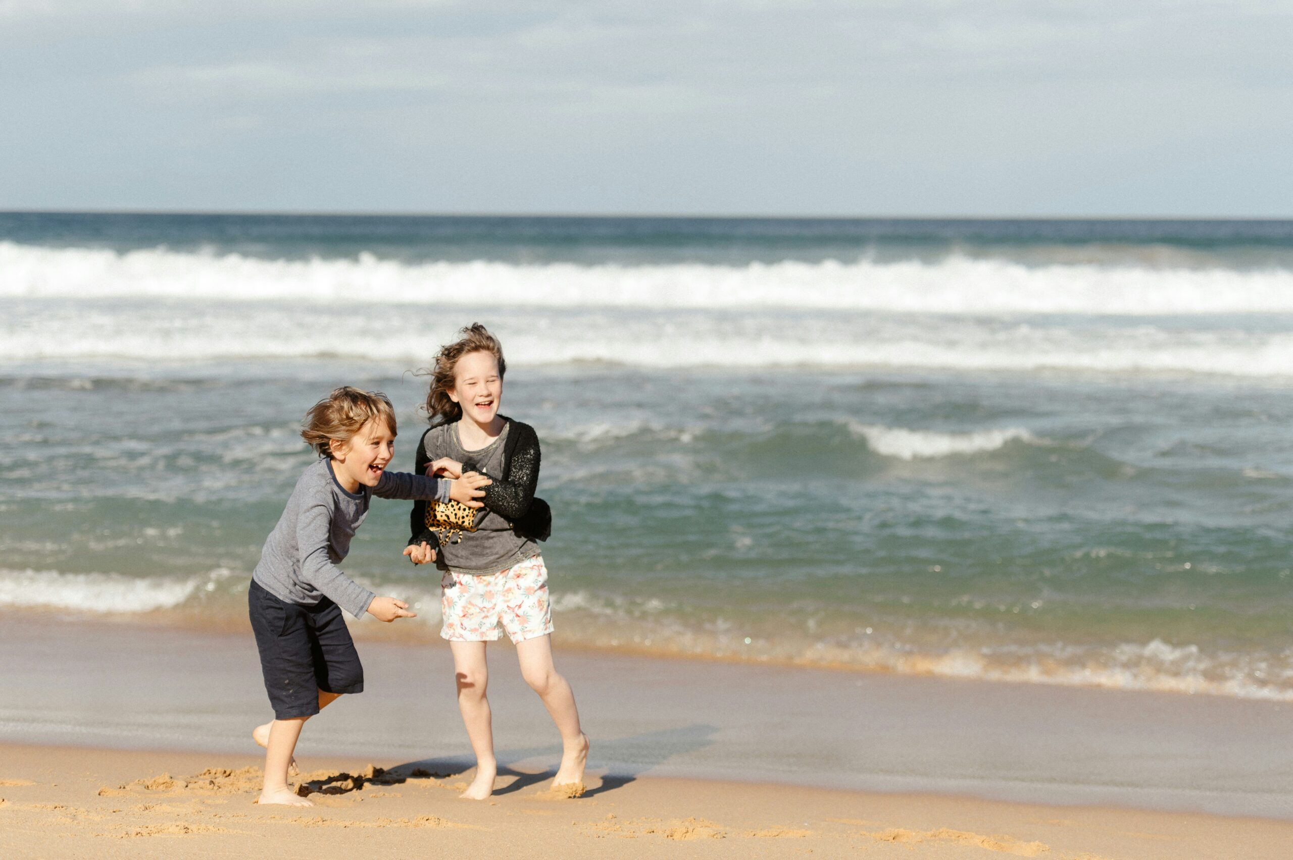 Kids playing on the beach, when to visit Darwin with Kids